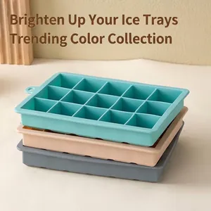 Set of stacked silicone ice cube trays in cyan beige and grey colors for home DIY use