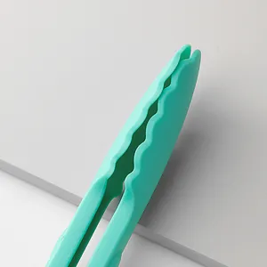 Premium 9-inch mint green plastic food tongs with scalloped edges for kitchen and baking use