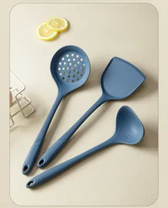 Three-piece set of blue silicone kitchen utensils: slotted spoon, spatula, and soup ladle.