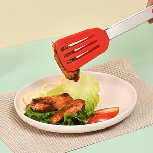 Premium red silicone tipped stainless steel food tongs holding a grilled chicken wing