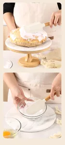 Detailed view of cream silicone spatula with beech wood handle used for cake baking