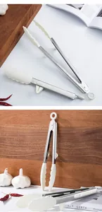 Detailed view of heat-resistant silicone food tongs with stainless steel handles.