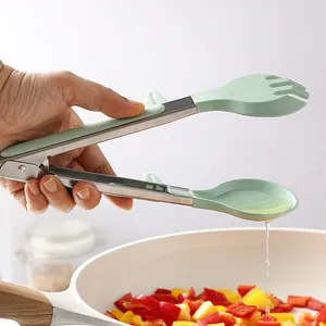 Stainless steel kitchen tongs with silicone heads for cooking and grilling vegetables