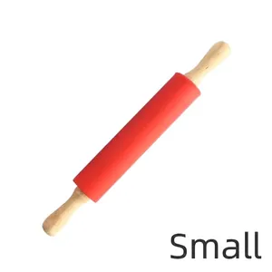Small red food-grade silicone rolling pin with ergonomic wooden handles for home baking.