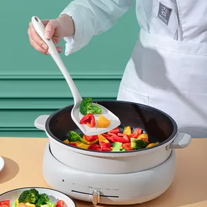 Heat-resistant white silicone spatula for non-stick cookware used in a kitchen setting
