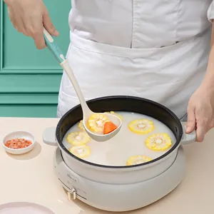Heat resistant cream silicone soup ladle for non-stick cookware in a lifestyle kitchen scene