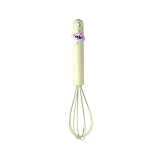 Cream-colored mini silicone hand whisk with cute cartoon bunny for non-stick cookware