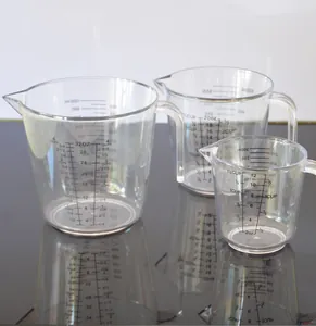 Set of three clear plastic measuring cups with handles and dual scale markings