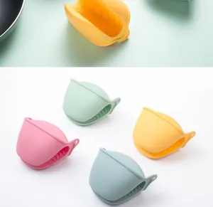 Set of four colorful silicone heat-resistant oven mitts for kitchen baking and cooking.