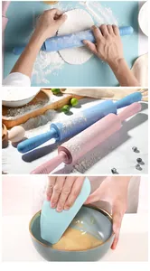 Detail showing silicone rolling pins and scraper being used for dough and mixing.