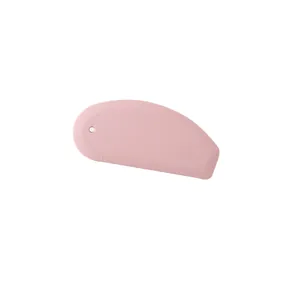 Pink silicone dough scraper with integrated measurement scale for professional kitchen baking.
