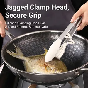Silicone kitchen food tongs with stand flipping fish in a stainless steel wok