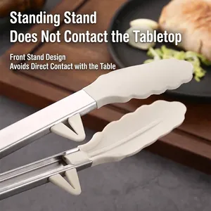 Heat resistant silicone food tongs with integrated stand for hygienic kitchen use