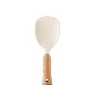 Ergonomic non-stick silicone rice paddle featuring a premium natural wood handle