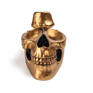 Handcrafted creative golden skull resin eyeglass holder and desk key organizer sculpture