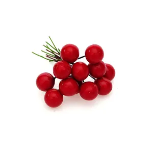Detailed view of glossy artificial red foam berries for Christmas decoration