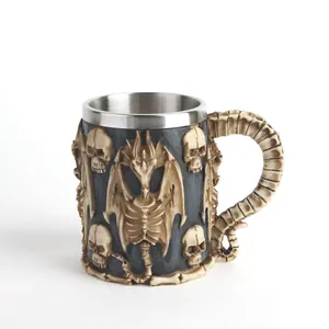 Detailed view of the 3D relief dragon skeleton and skull on the gothic resin mug