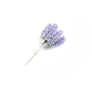 Detail view of a purple artificial lavender bunch with six stems on white background.