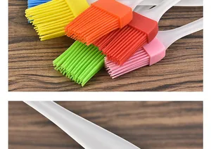 Detailed macro view of colorful heat-resistant silicone basting brush heads and handles