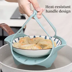 Multifunctional light blue silicone steamer basket with anti-scald handles for pans