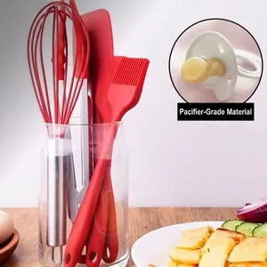 Red 5-piece food-grade silicone kitchen utensil set including whisk and spatulas