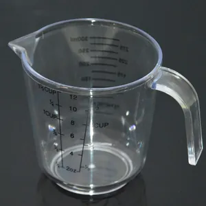 Clear plastic measuring cup with handle and double-sided scales for precise baking
