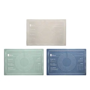 Set of three food-grade silicone pastry mats with measurement markings in green, blue, and beige