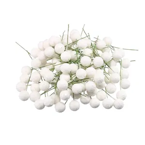 Close-up of artificial white glitter berries with stems for Christmas DIY decor