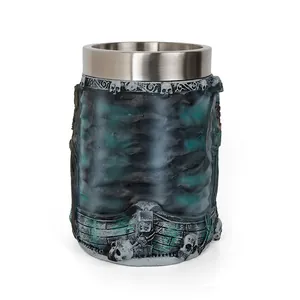 Detail view of pirate themed resin beer mug with stainless steel liner and skull motifs