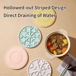 Set of colorful heat-resistant silicone placemats with snowflake and round patterns