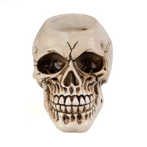 Close-up detail of vintage resin skull candle holder for gothic home decor