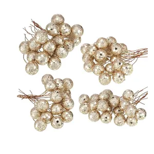 Detailed view of golden glitter artificial berry clusters for festive Christmas DIY crafts