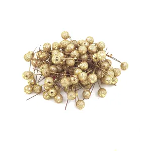 Detailed macro view showing a pile of golden glittery berries for Christmas DIY decor