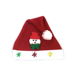 Close-up of festive children's Santa hat with cute snowman motif and snowflake sequins