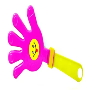 Detailed view of a vibrant pink and yellow plastic hand clapper noise maker prop