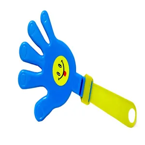 Detailed view of a blue and yellow hand clapper noisemaker with a happy smiley face sticker