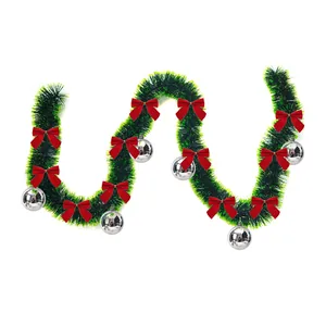 2m dark green Christmas tinsel garland decorated with red bows and silver balls