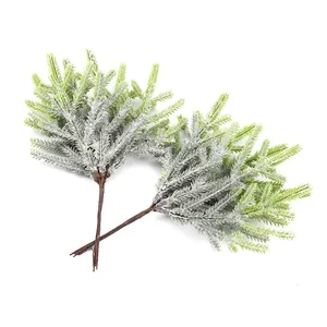 Close-up macro view of high-quality artificial frosted pine needles for home festive decoration