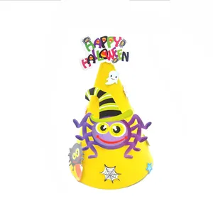 Detailed view of yellow Halloween DIY paper hat with spider and ghost motifs