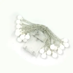 A detailed view of frosted ball LED string lights featuring a clear plastic battery box