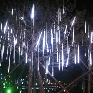 Detailed macro view of 1m long white meteor shower LED rain lights for outdoor trees