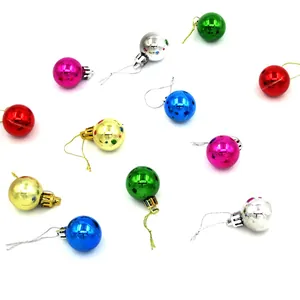 Close-up detail of colorful shiny Christmas ball ornaments in red, blue, and gold