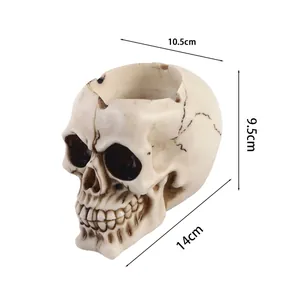 Specifiche dimensionali dettagliate per il posacenere a teschio in resina: 14cm x 10,5cm x 9,5cm