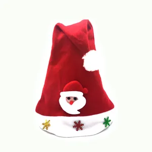 Close-up of children's Santa hat with cartoon Santa appliqué and colorful snowflakes.