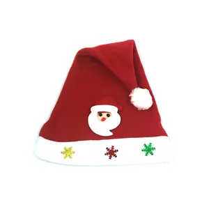 Detailed view of children's Santa hat with snowflakes and cartoon patch