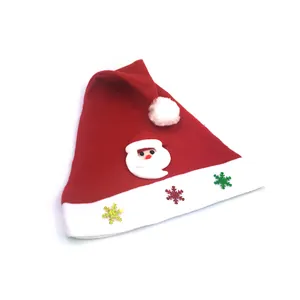 Detail view of a kids Christmas hat with Santa Claus applique and colorful snowflakes.