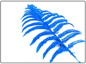 Detailed close-up of blue glittery artificial fern leaf for festive Christmas tree decoration