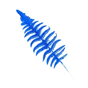 Detailed view of artificial blue glitter fern leaf for festive Christmas tree decoration