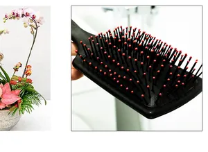 Black paddle hairbrush with red tip pins for scalp massage and anti-tangle daily hair care.