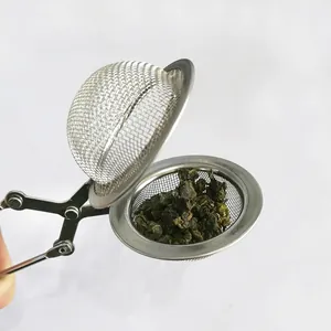 Stainless steel tea infuser with scissor handle and mesh tea ball for loose leaf tea.